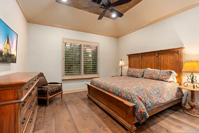 a bed room with a bed and a chair