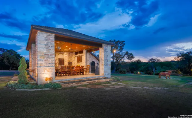 a view of a house with a yard and tree s