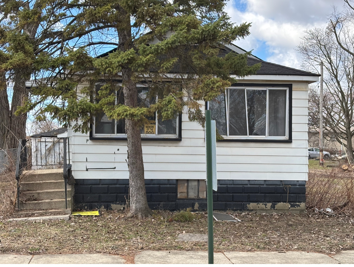 15316 4th Avenue Phoenix, IL 60426 - Photo 1 of 1 a view of a house with a yard tree and wooden fence