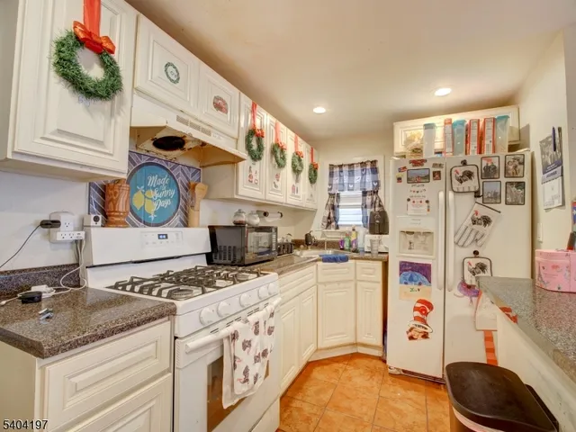 a kitchen with stainless steel appliances granite countertop a stove and a sink
