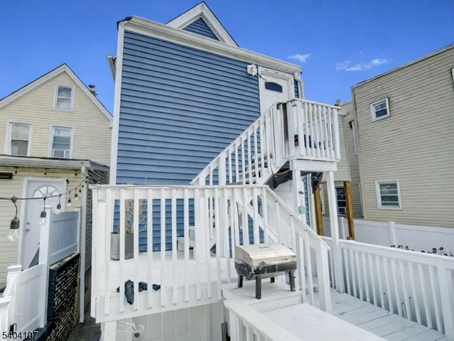 a view of entryway with wooden stairs