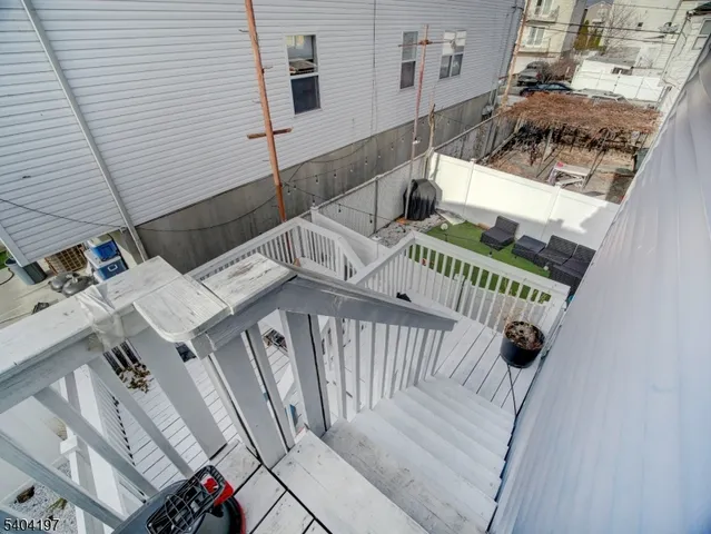 a view of balcony with furniture