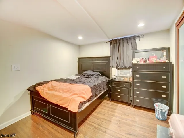 a bed room with a bed and a dresser
