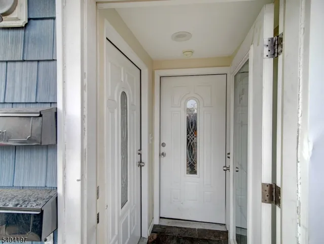 a view of a hallway with closet and entryway