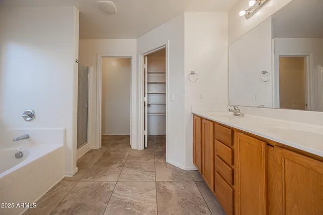 a bathroom with a bathtub and a sink