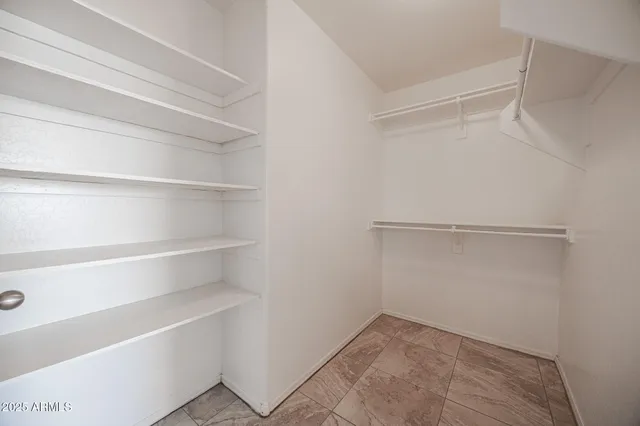 a view of an empty walk in closet