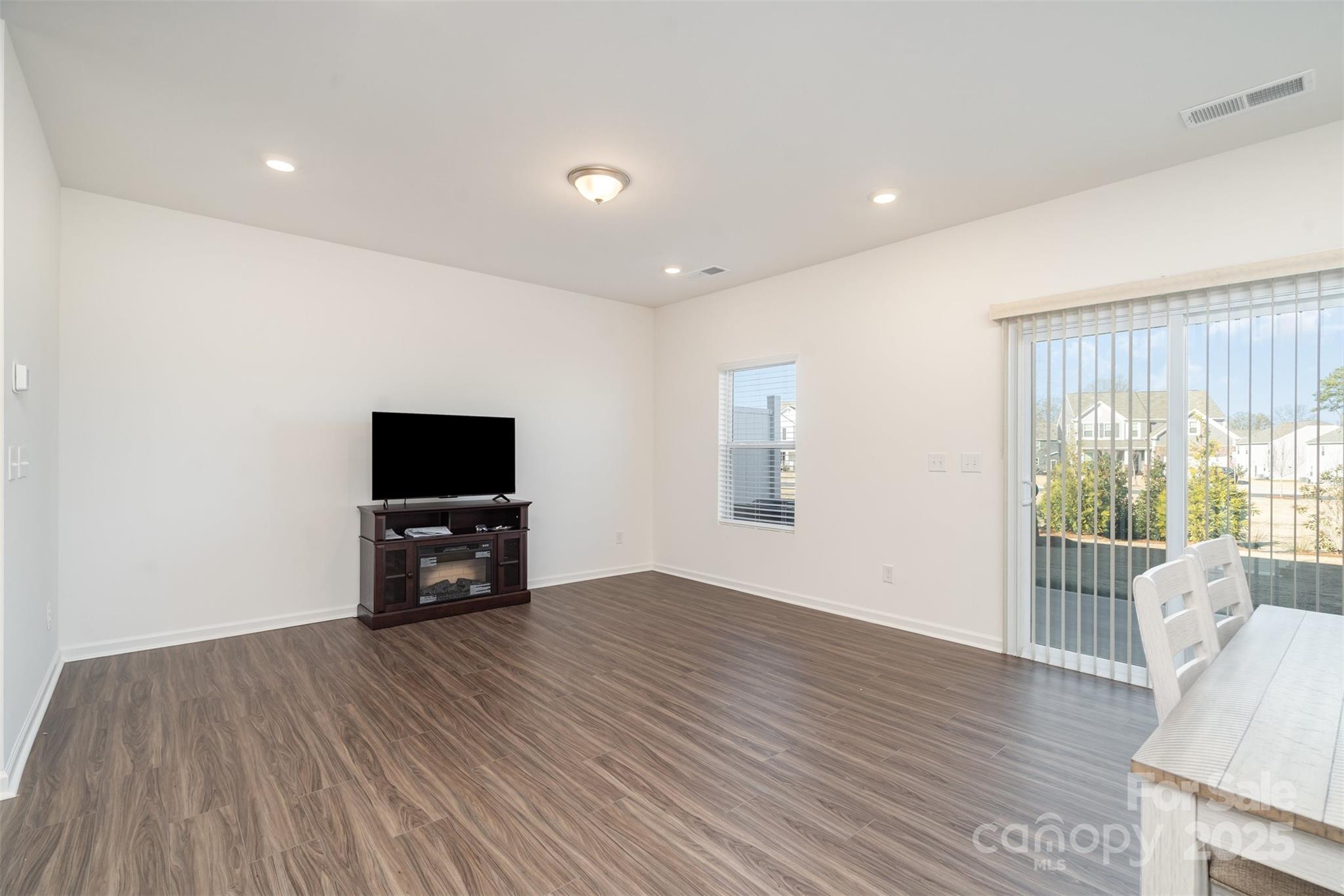 781 Earhart Street Northwest Concord, NC 28027 - Photo 2 of 31 a view of a livingroom with furniture and wooden floor