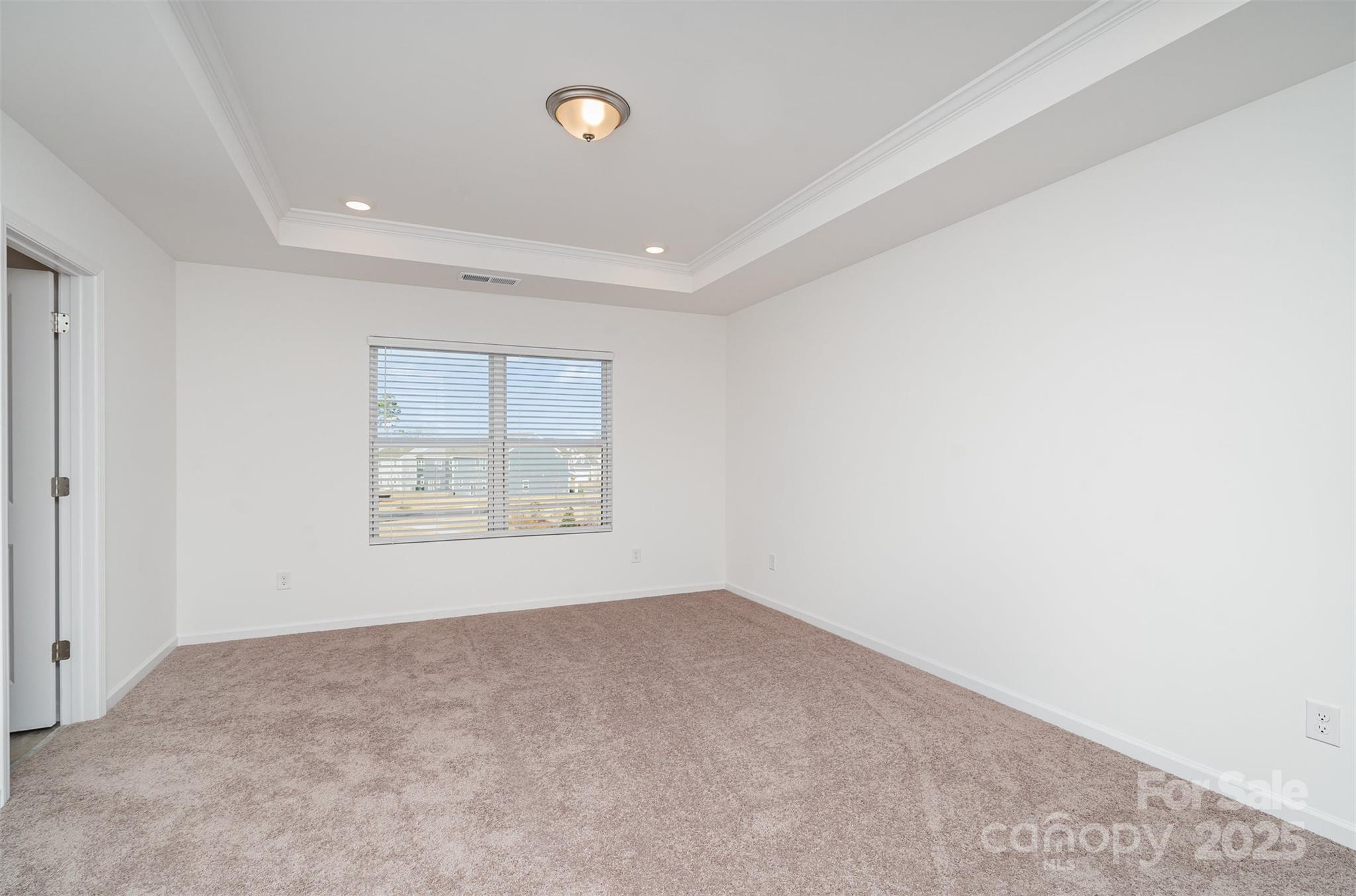 781 Earhart Street Northwest Concord, NC 28027 - Photo 21 of 31 a view of an empty room with a window