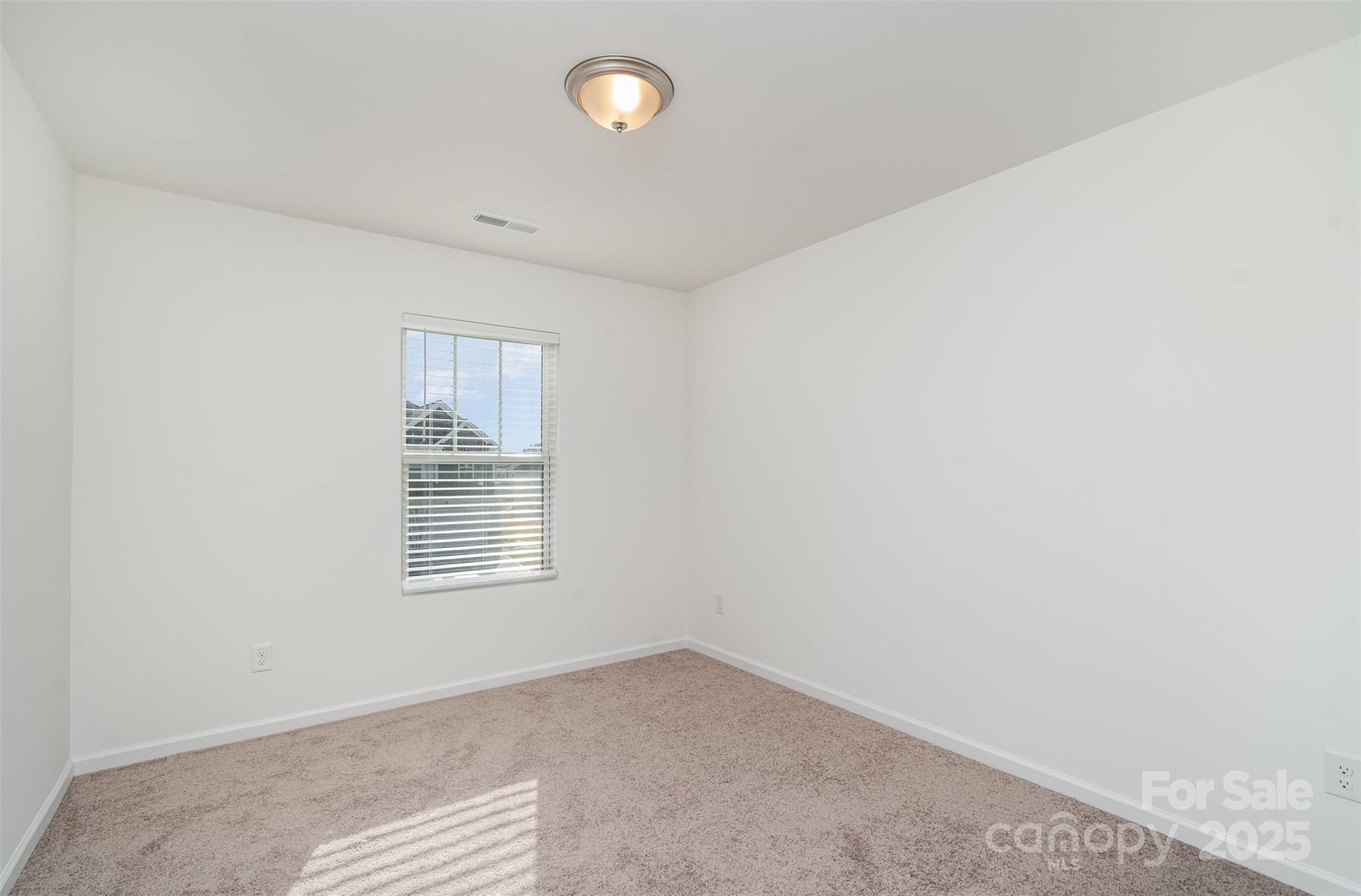 781 Earhart Street Northwest Concord, NC 28027 - Photo 23 of 31 an empty room with windows