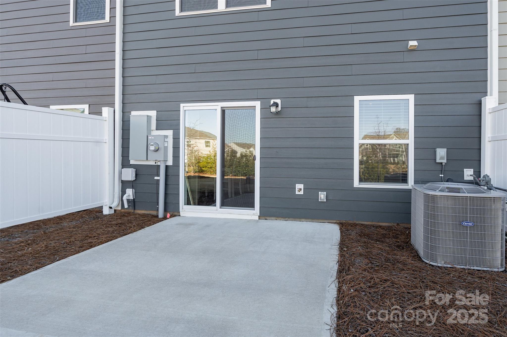 781 Earhart Street Northwest Concord, NC 28027 - Photo 26 of 31 a view of a house with a backyard