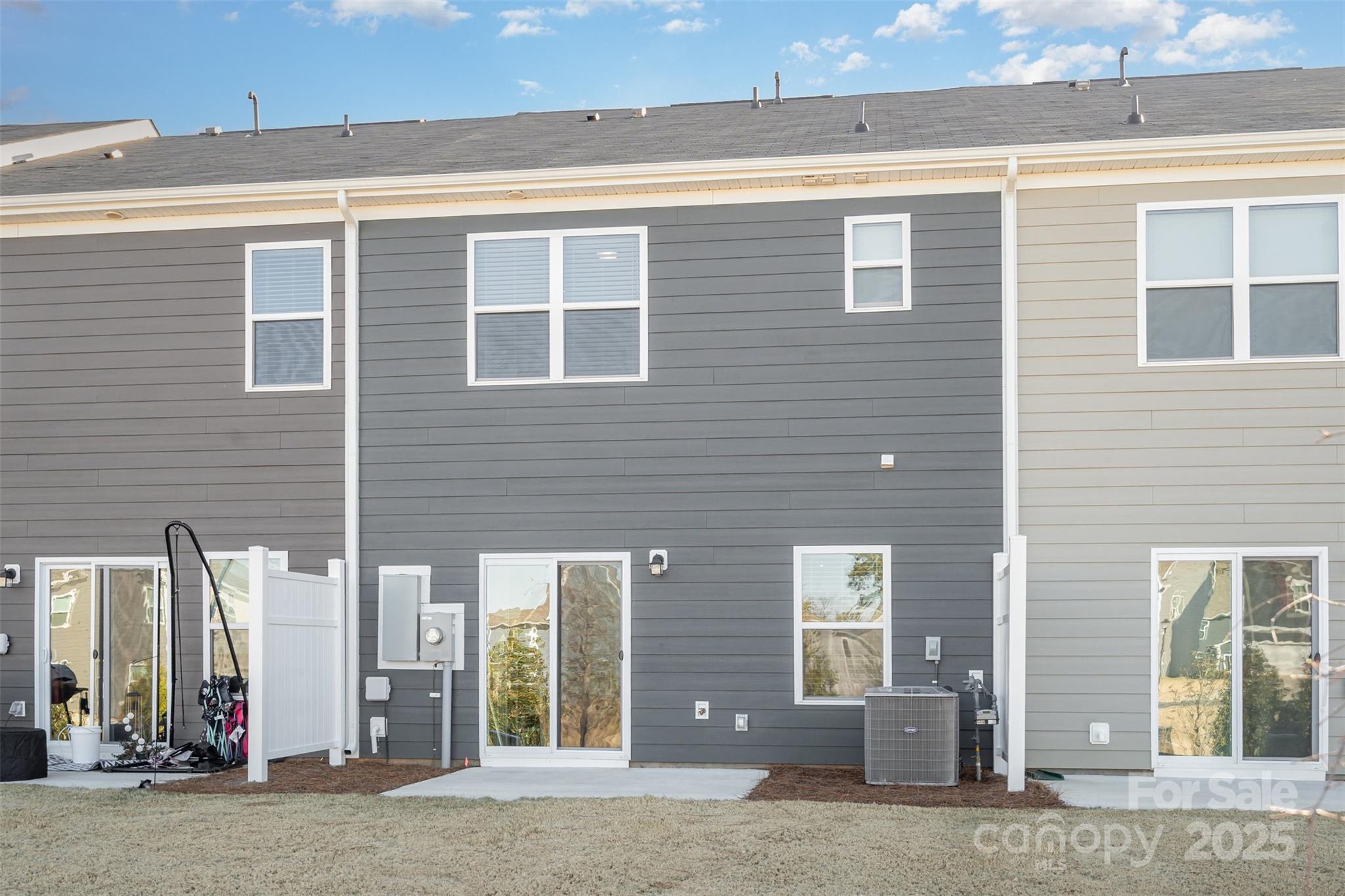781 Earhart Street Northwest Concord, NC 28027 - Photo 27 of 31 a view of a brick building next to a yard