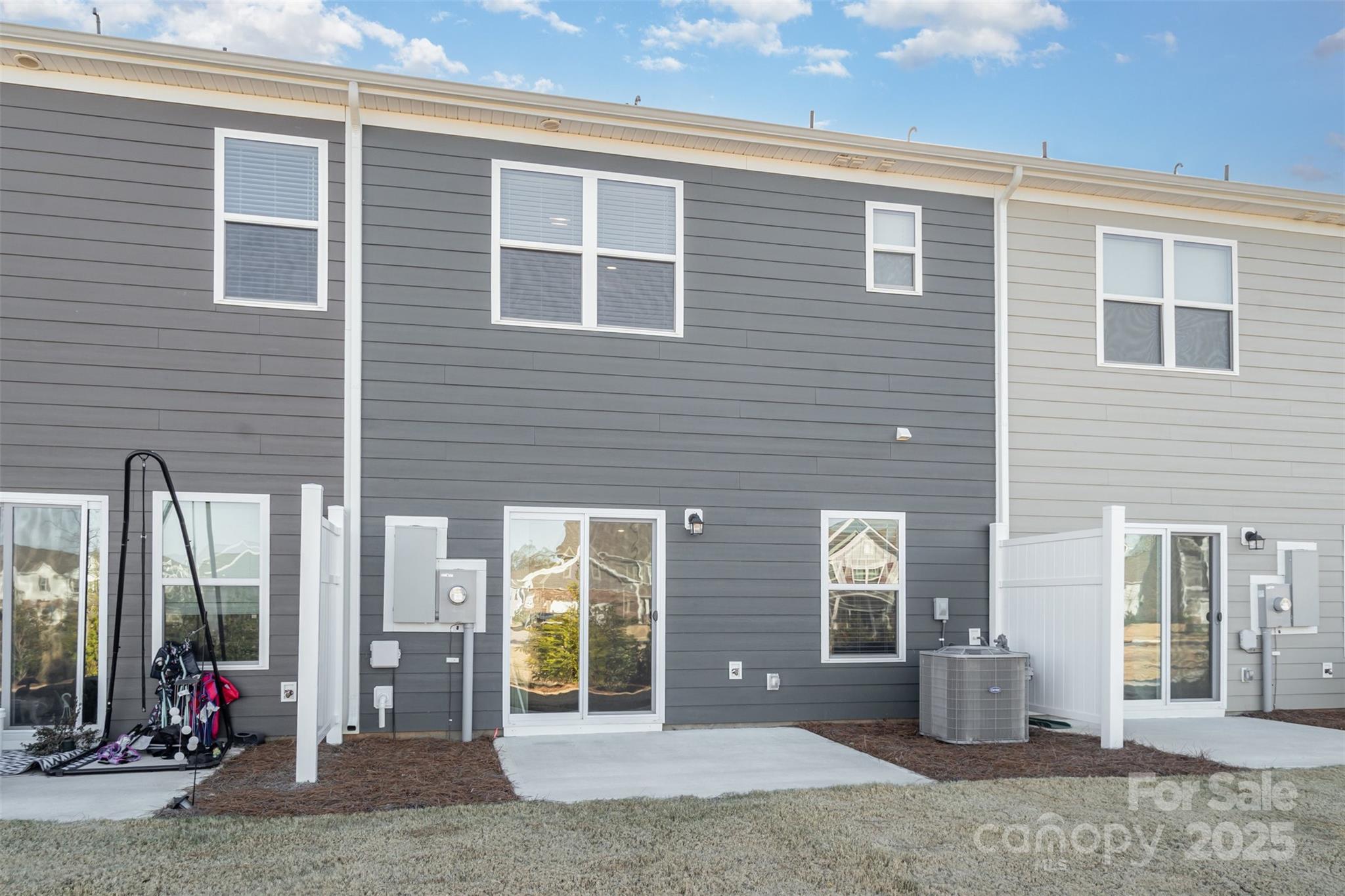 781 Earhart Street Northwest Concord, NC 28027 - Photo 31 of 31 a view of a brick house with many windows