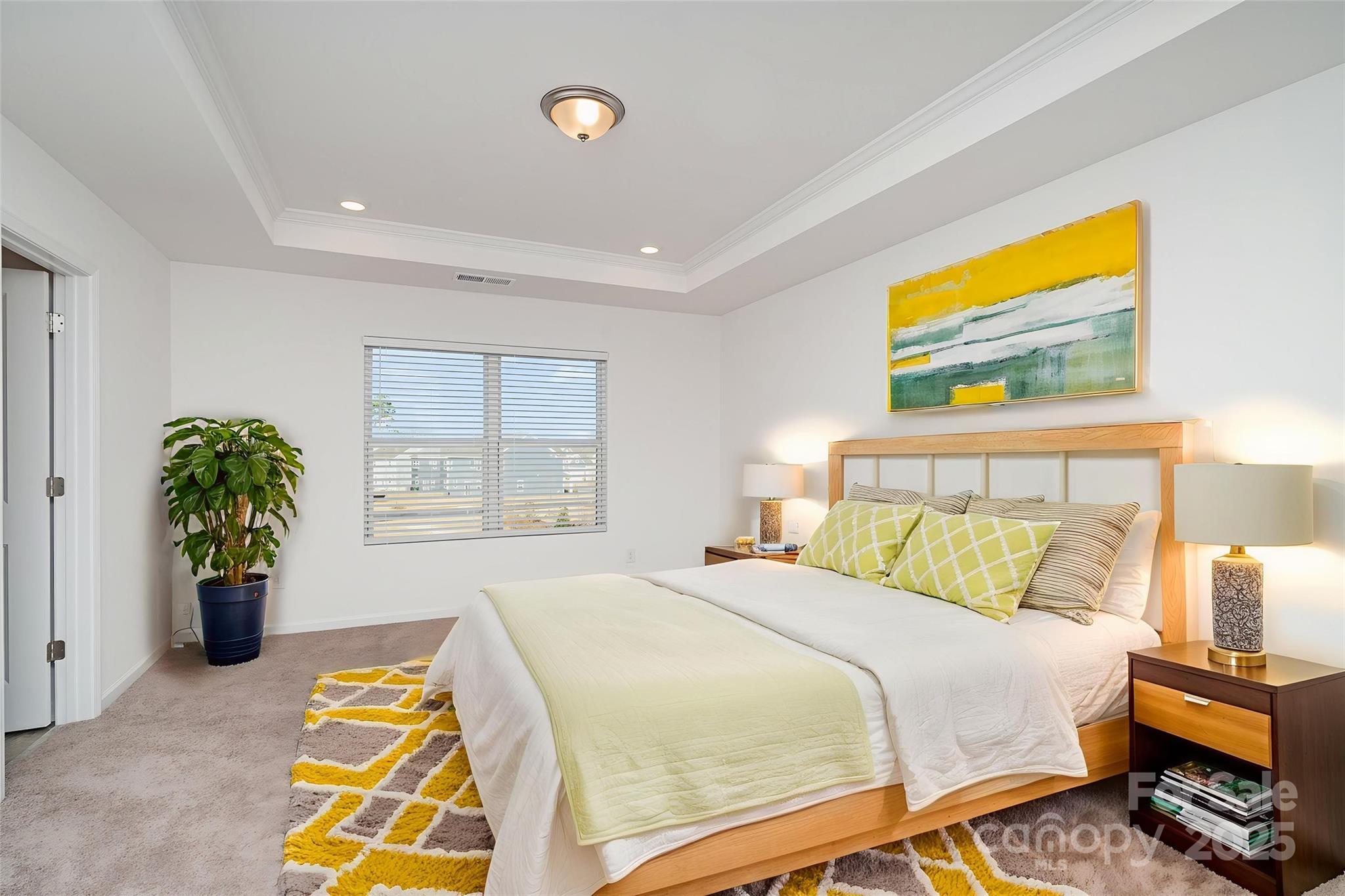 781 Earhart Street Northwest Concord, NC 28027 - Photo 4 of 31 a bedroom with a bed and a window