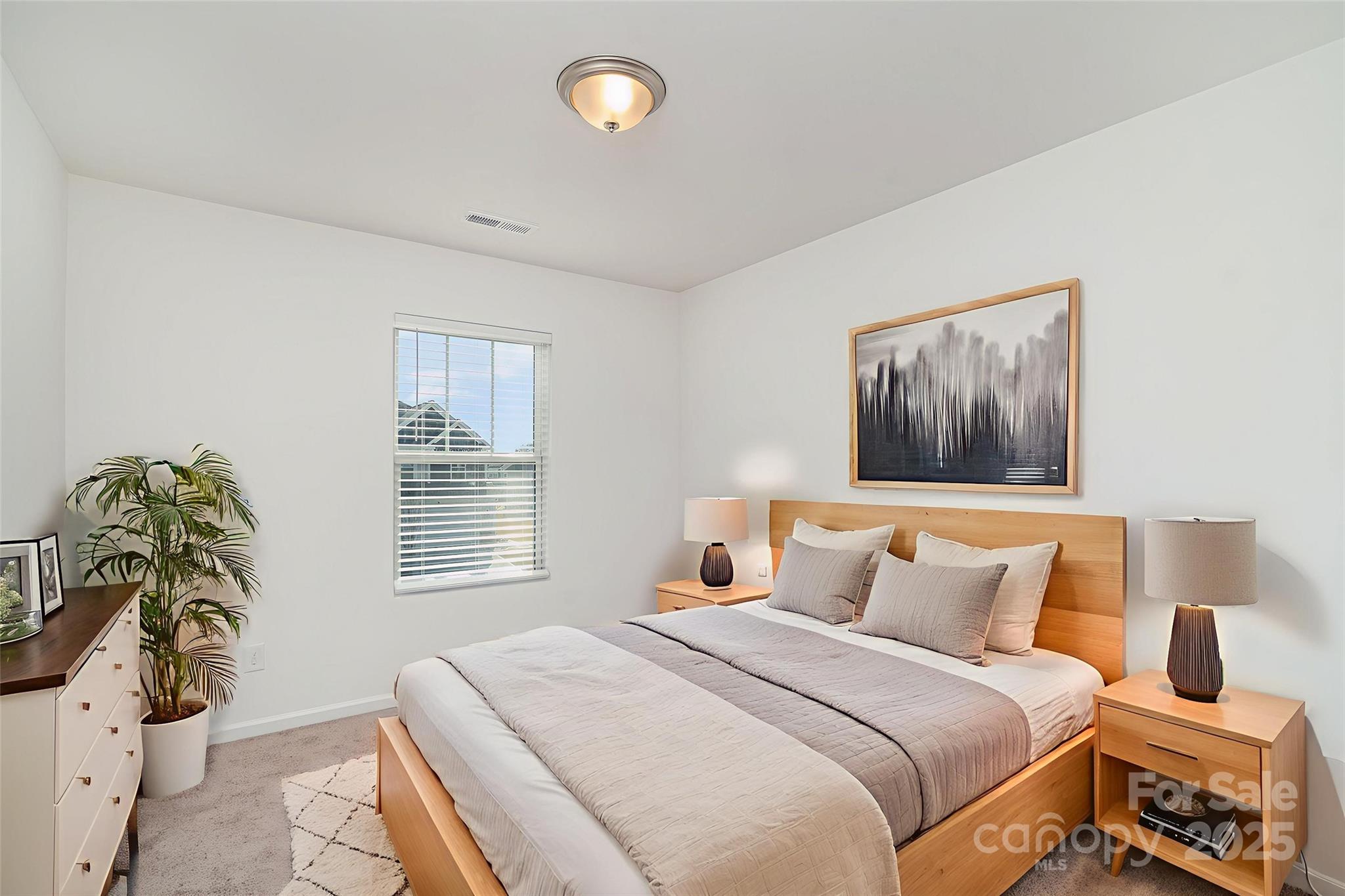 781 Earhart Street Northwest Concord, NC 28027 - Photo 6 of 31 a bedroom with a bed and a window