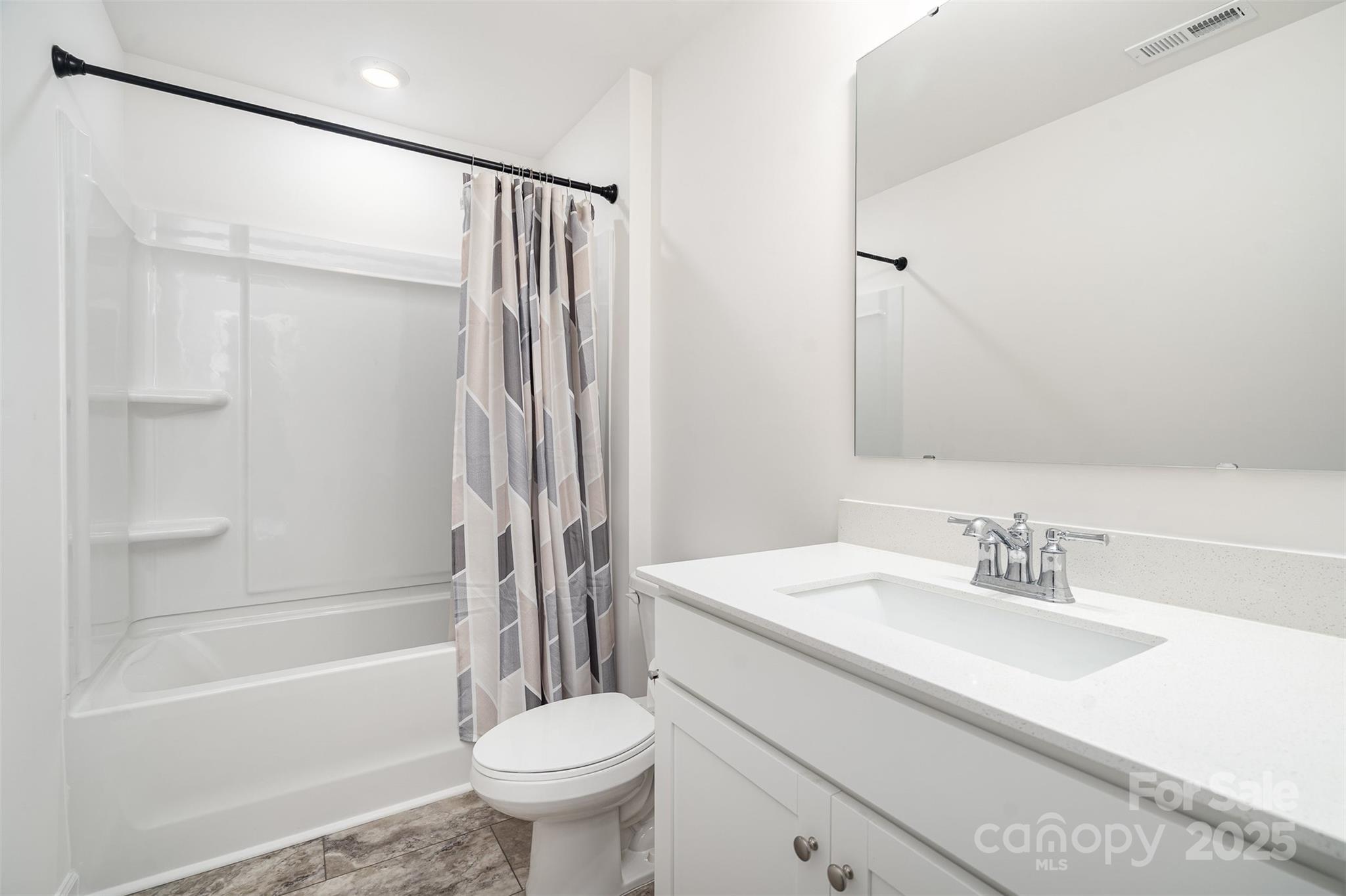 781 Earhart Street Northwest Concord, NC 28027 - Photo 7 of 31 a bathroom with a sink toilet and a bathtub