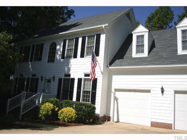 10013 Kilnstone Lane Raleigh, NC 27613 - Photo 1 of 12 a front view of a house with garden