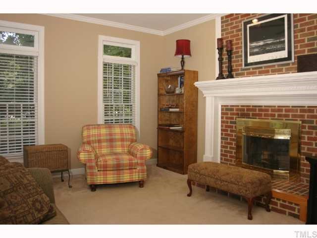 10013 Kilnstone Lane Raleigh, NC 27613 - Photo 2 of 12 a living room with furniture and a fireplace