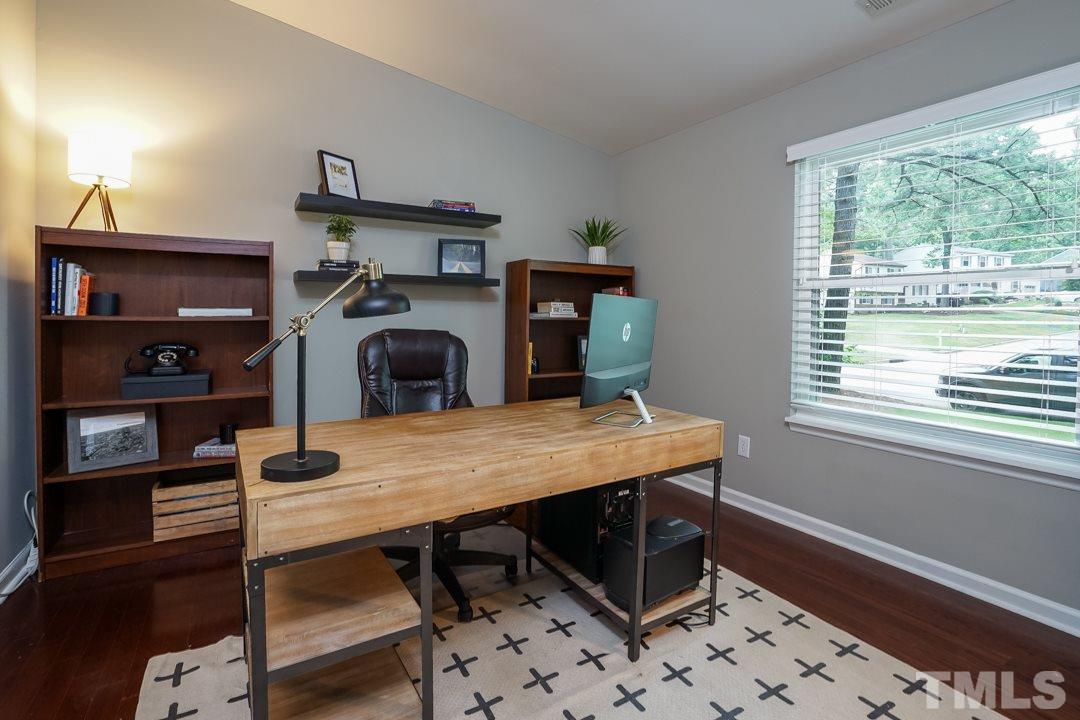 2433 Village Grove Road Raleigh, NC 27613 - Photo 2 of 24 a view of a workspace with furniture and a window