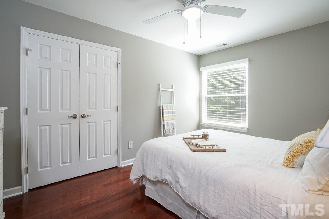 2433 Village Grove Road Raleigh, NC 27613 - Photo 18 of 24 a bedroom with a bed and a window