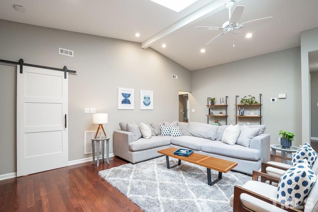 2433 Village Grove Road Raleigh, NC 27613 - Photo 10 of 24 a living room with furniture and a wooden floor