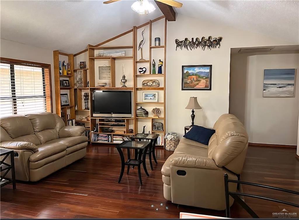 402 Jupiter Street Mission, TX 78572 - Photo 11 of 27 a living room with furniture and a flat screen tv