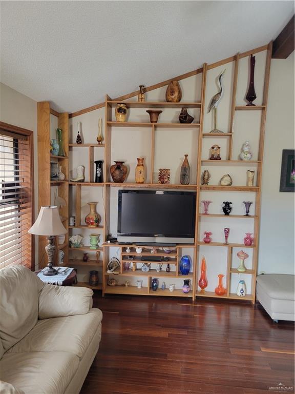 402 Jupiter Street Mission, TX 78572 - Photo 12 of 27 a living room with furniture and a flat screen tv