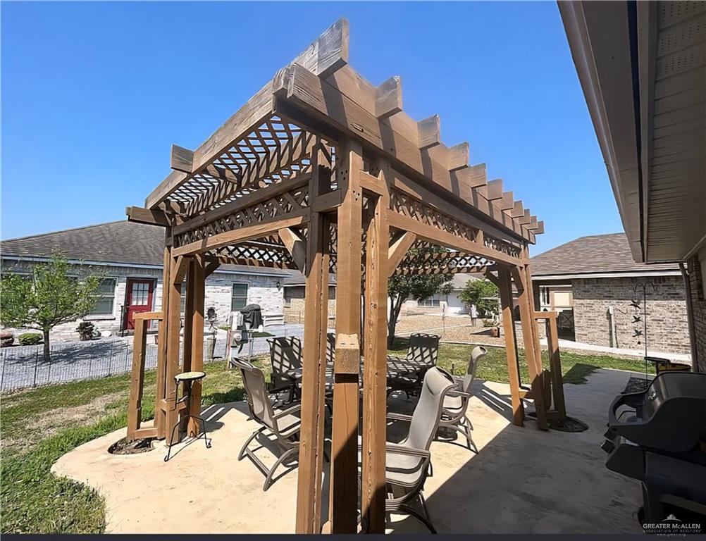 402 Jupiter Street Mission, TX 78572 - Photo 20 of 27 a view of a house with backyard porch and sitting area