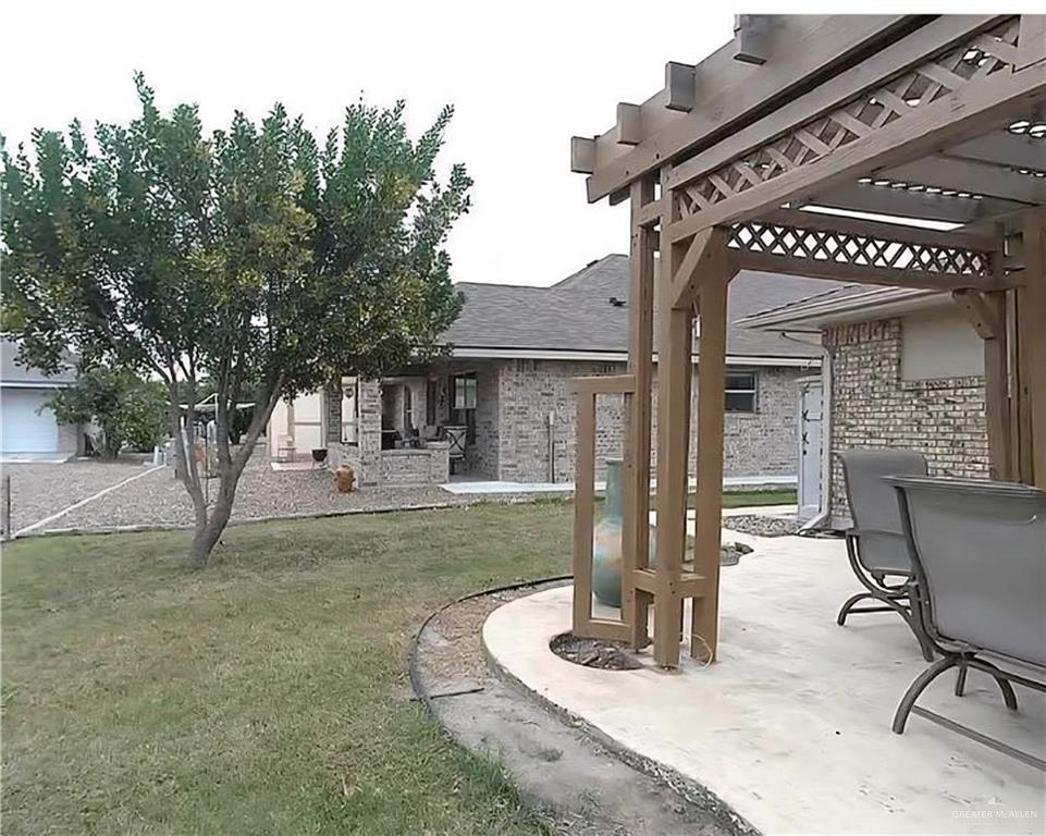 402 Jupiter Street Mission, TX 78572 - Photo 21 of 27 a view of a house with backyard porch and sitting area