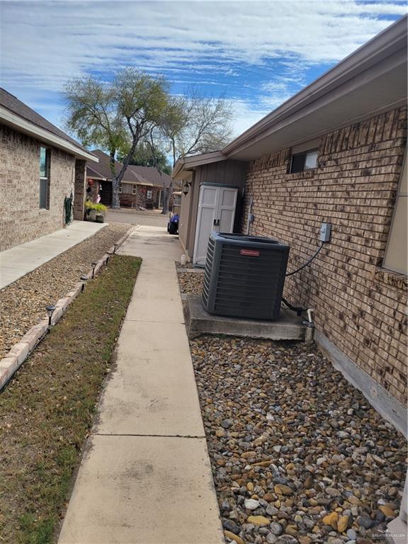 402 Jupiter Street Mission, TX 78572 - Photo 25 of 27 a front view of a house with a garden