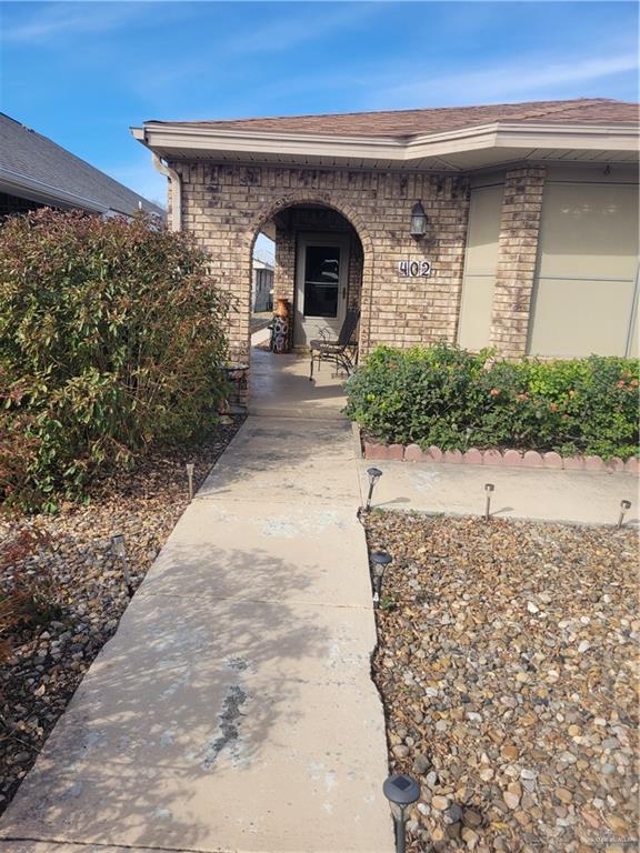 402 Jupiter Street Mission, TX 78572 - Photo 4 of 27 a front view of a house with yard