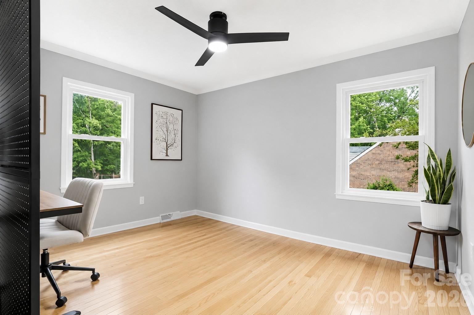 824 Riverwood Road Charlotte, NC 28270 - Photo 14 of 37 a view of a room with wooden floor and windows