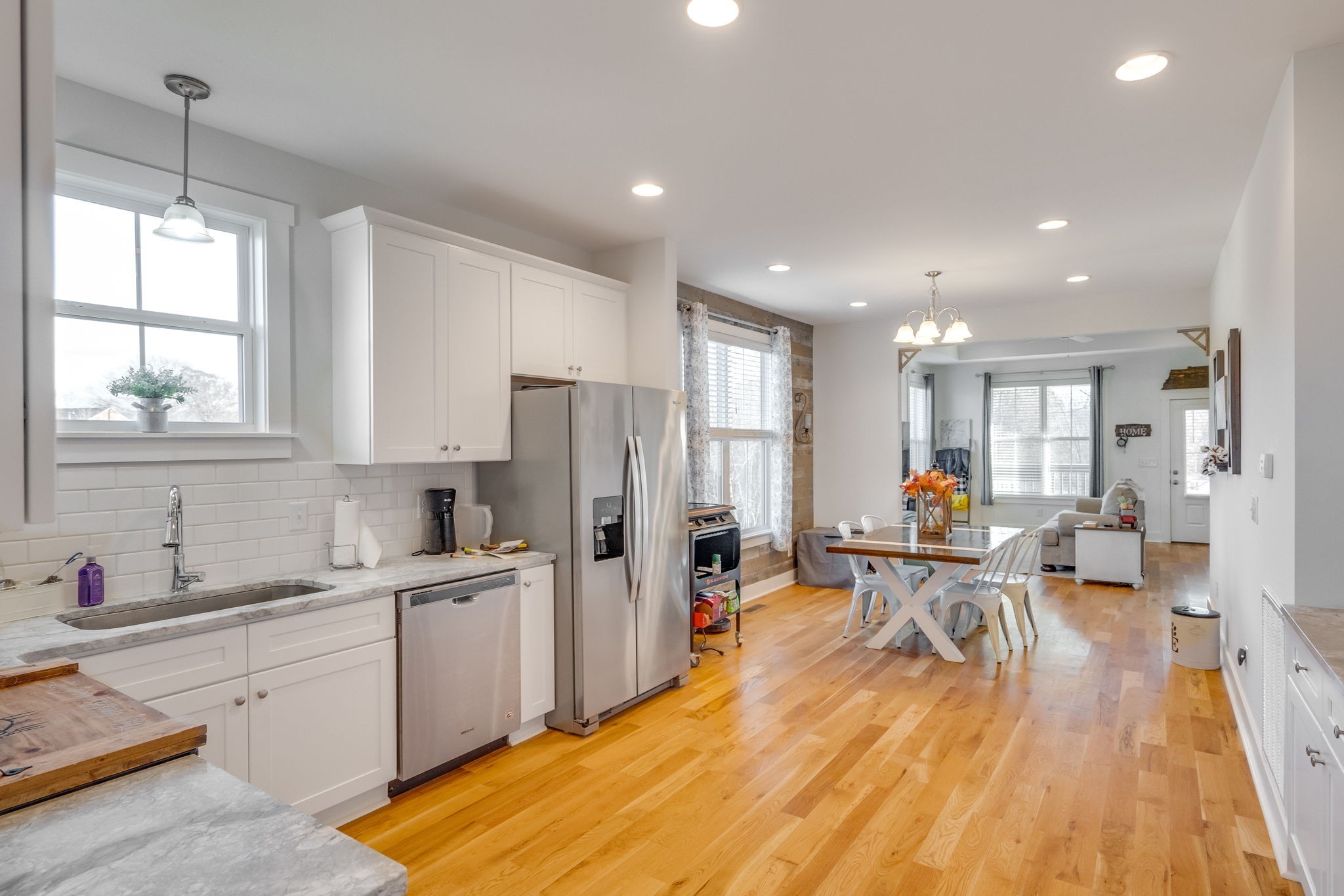 609 Womack Road Bethpage, TN 37022 - Photo 6 of 14 a large kitchen with stainless steel appliances a large counter top a sink a refrigerator and cabinets