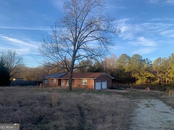 a view of house with outdoor space