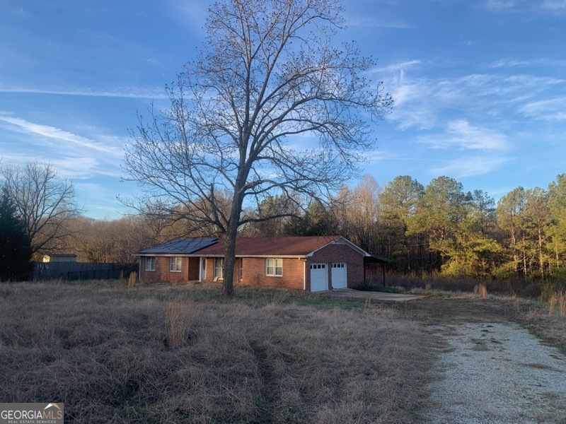 a view of house with outdoor space