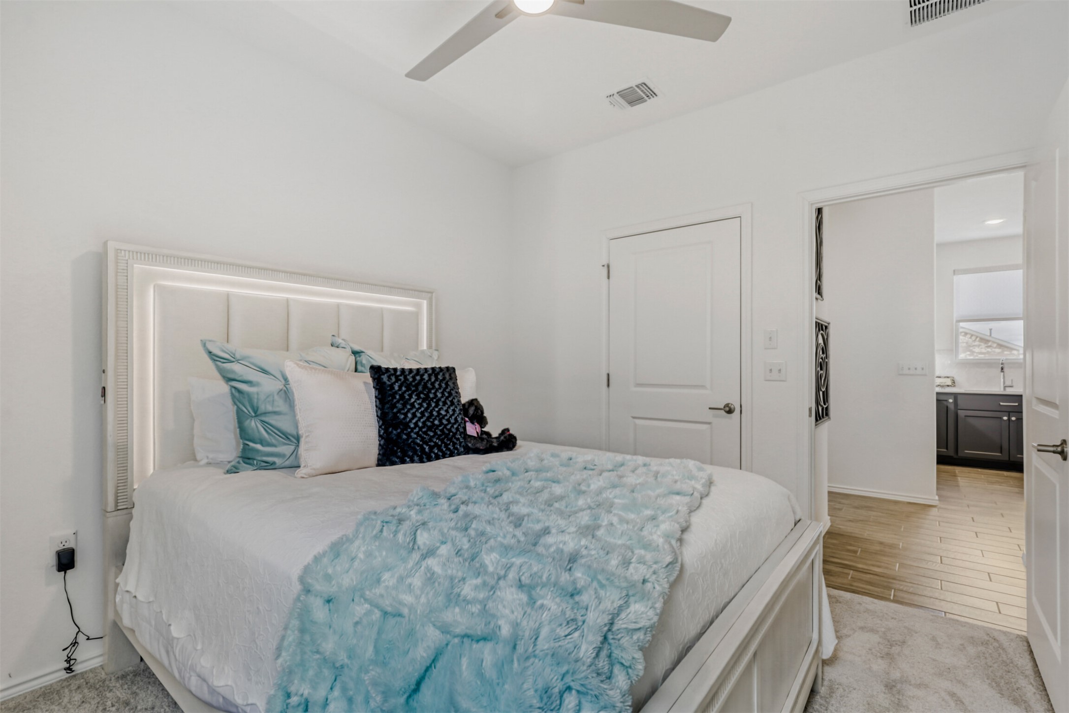 126 Clay Hl Street Georgetown, TX 78633 - Photo 15 of 20 Bedroom featuring ceiling fan and light carpet