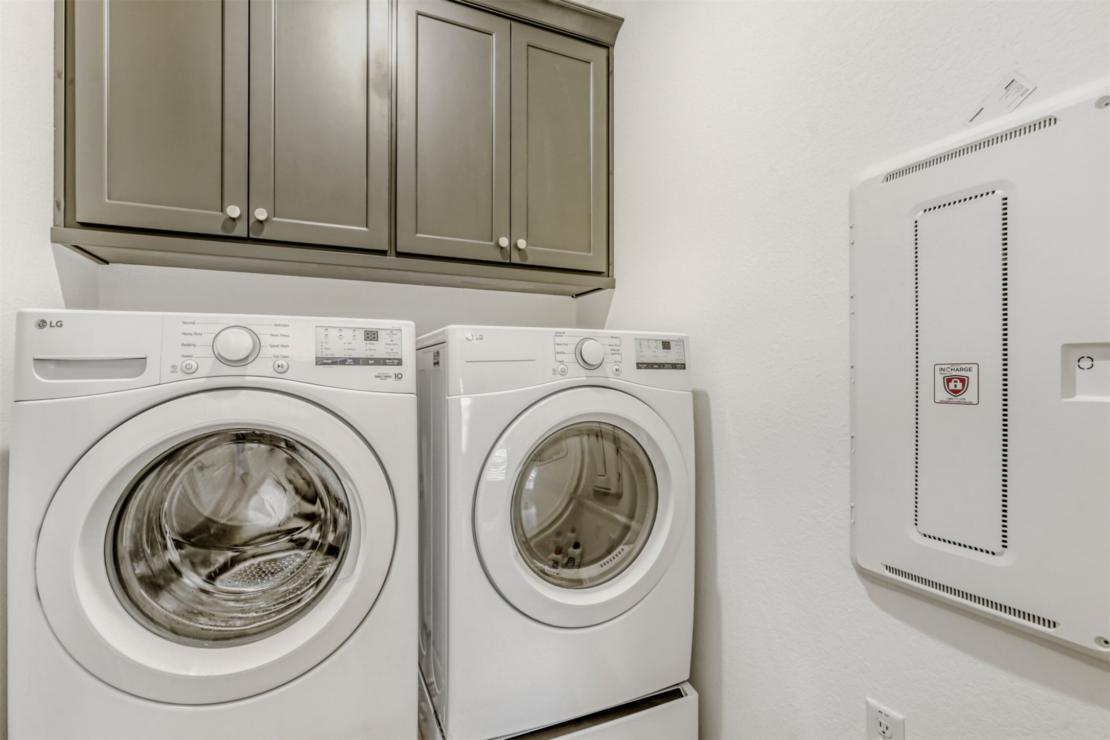 126 Clay Hl Street Georgetown, TX 78633 - Photo 17 of 20 Laundry area with washing machine and clothes dryer and cabinet space