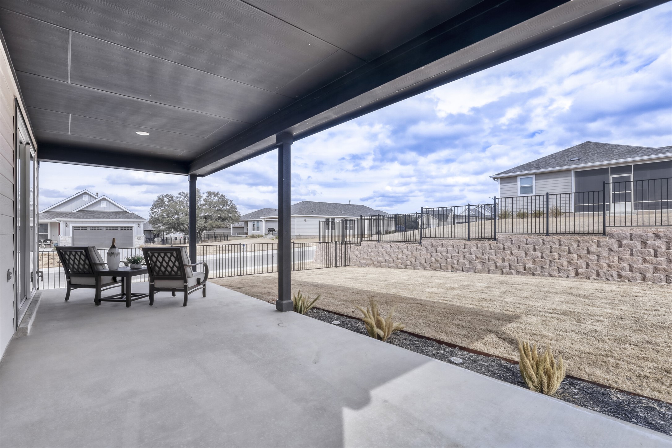 126 Clay Hl Street Georgetown, TX 78633 - Photo 18 of 20 Fenced backyard featuring a patio and a residential view