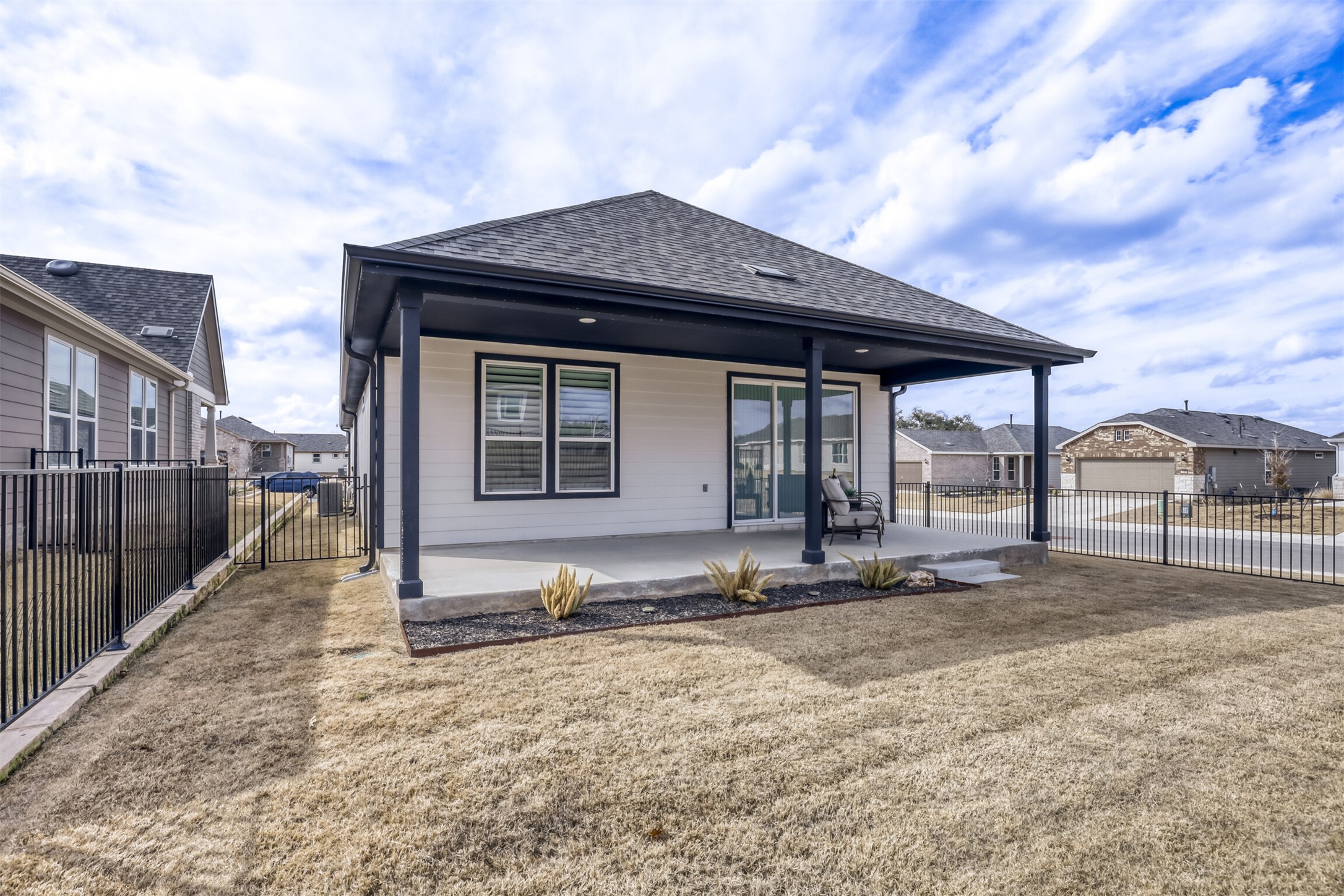 126 Clay Hl Street Georgetown, TX 78633 - Photo 19 of 20 Back of house featuring a fenced backyard, a patio, roof with shingles, and a gate