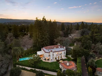 an aerial view of a house with a garden