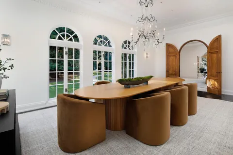 a view of a kitchen with granite countertop a sink and a large window