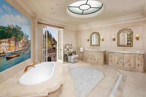 a bedroom with bed and ceiling fan