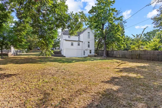 a house with trees in front of it
