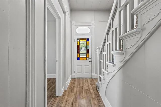 a view of an entryway with wooden floor