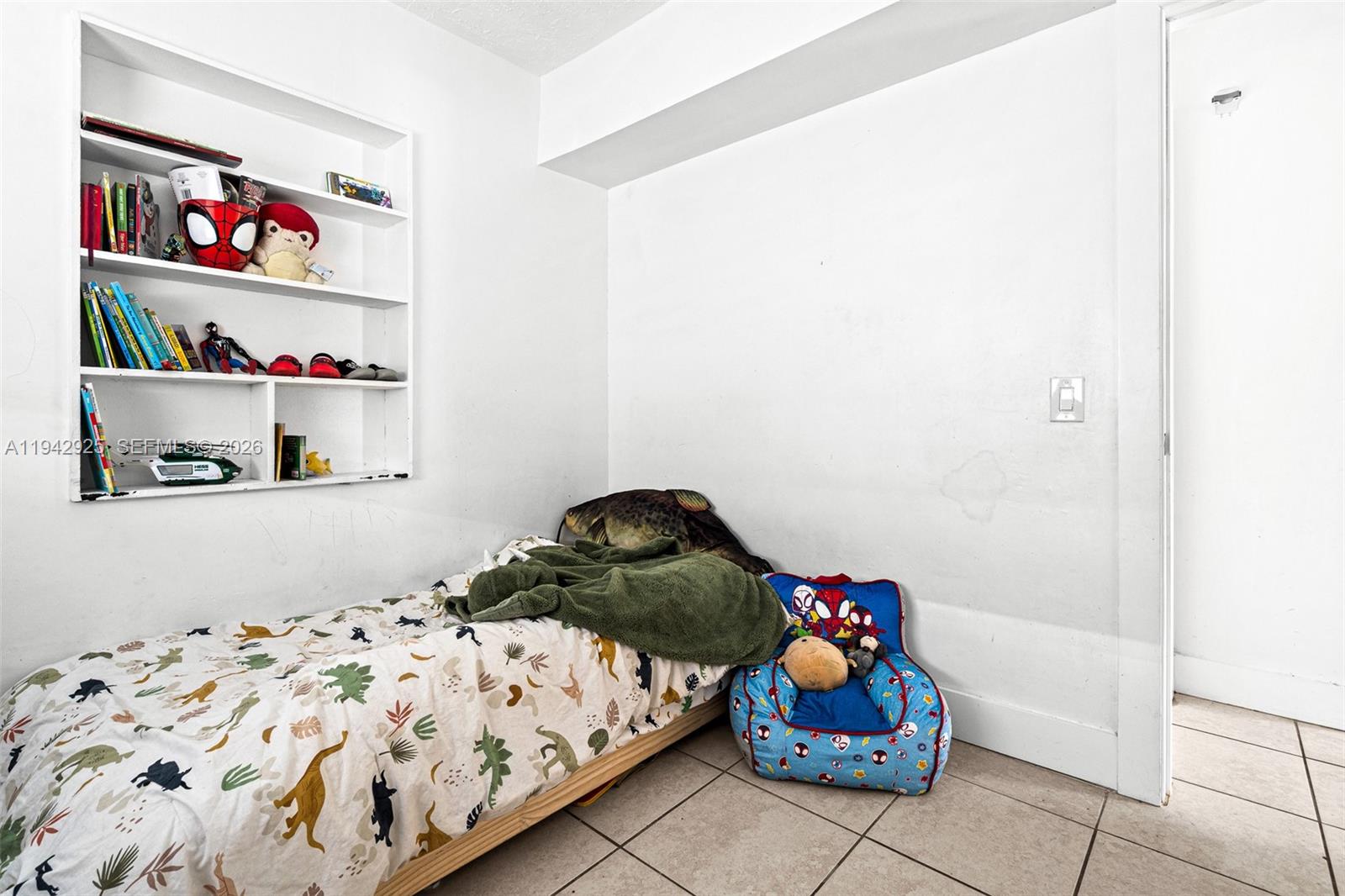 5844 Garfield Street Hollywood, FL 33021 - Photo 19 of 31 a bedroom with bed and cabinets