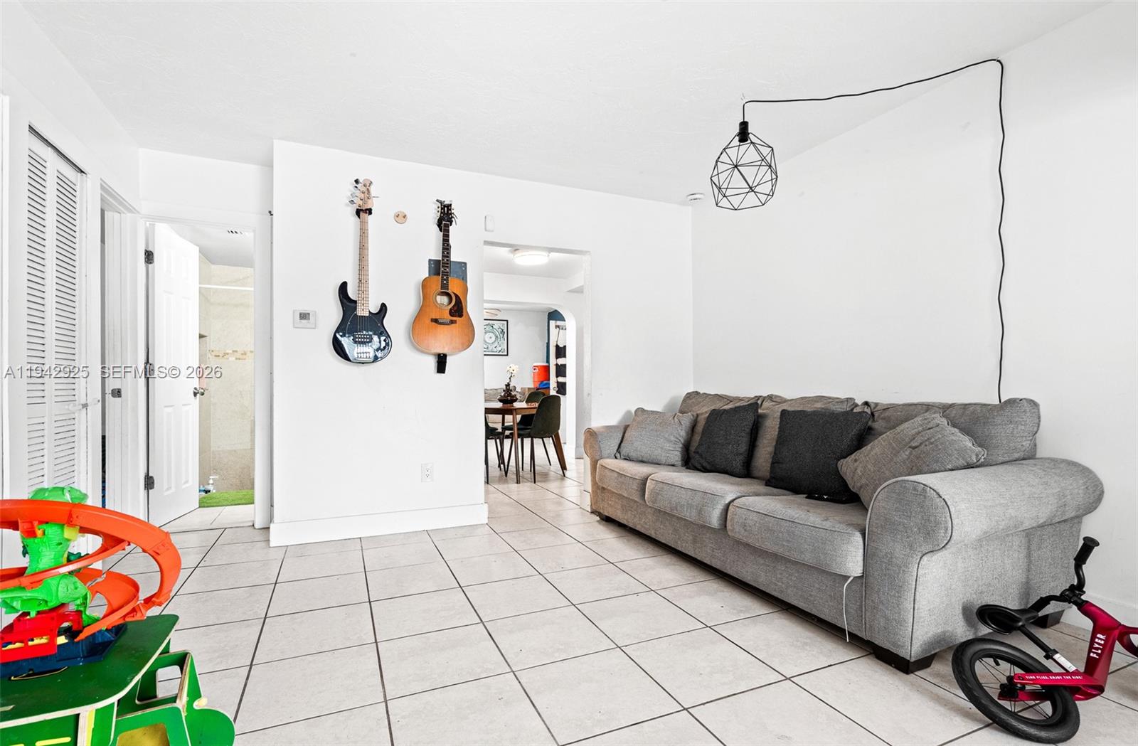 5844 Garfield Street Hollywood, FL 33021 - Photo 22 of 31 a living room with furniture and a table