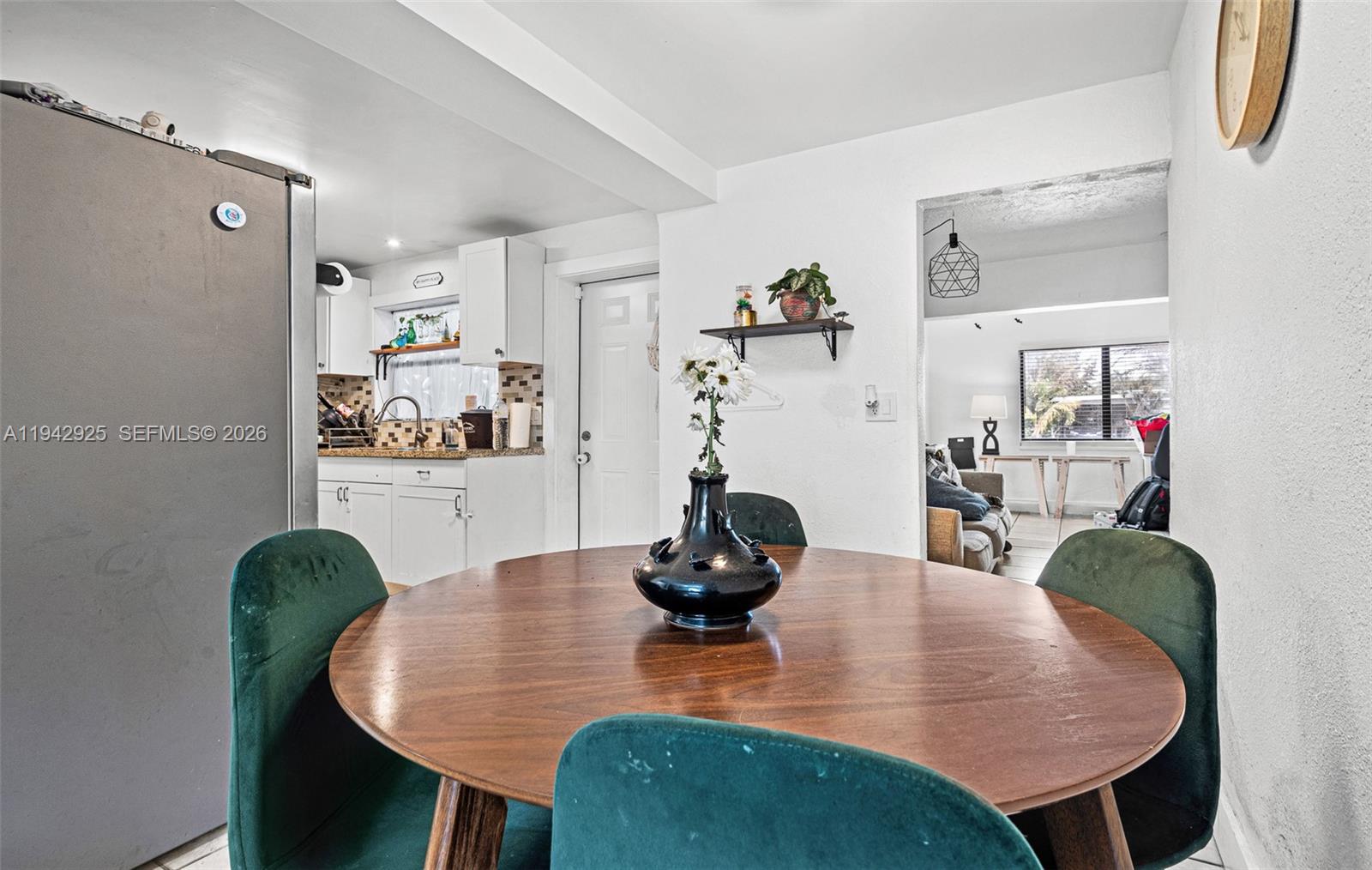 5844 Garfield Street Hollywood, FL 33021 - Photo 5 of 31 a dining room with furniture and wooden floor