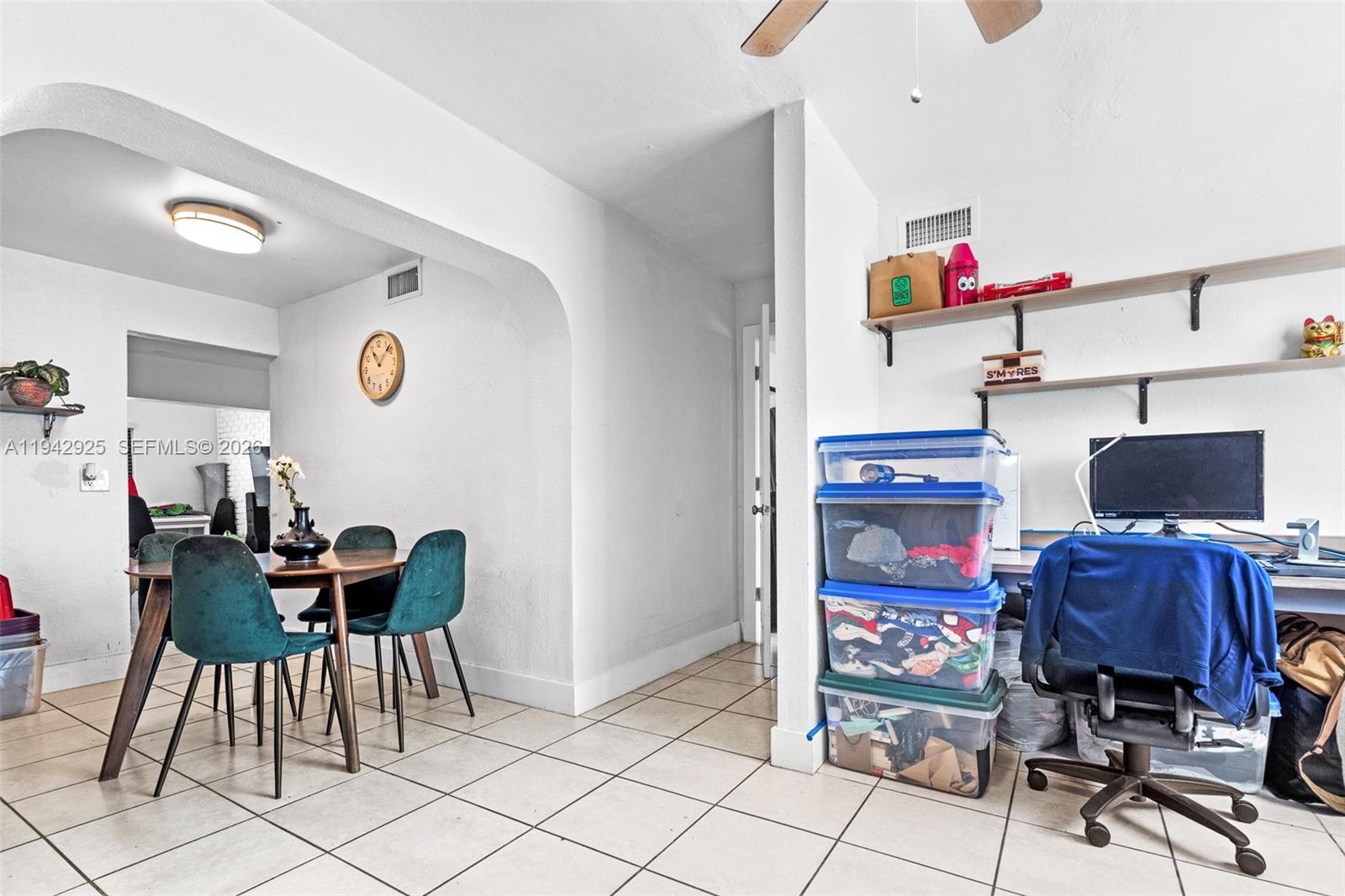 5844 Garfield Street Hollywood, FL 33021 - Photo 9 of 31 a dining room with furniture and musical instruments