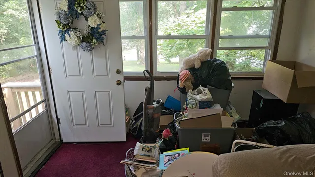 a room with furniture and a window