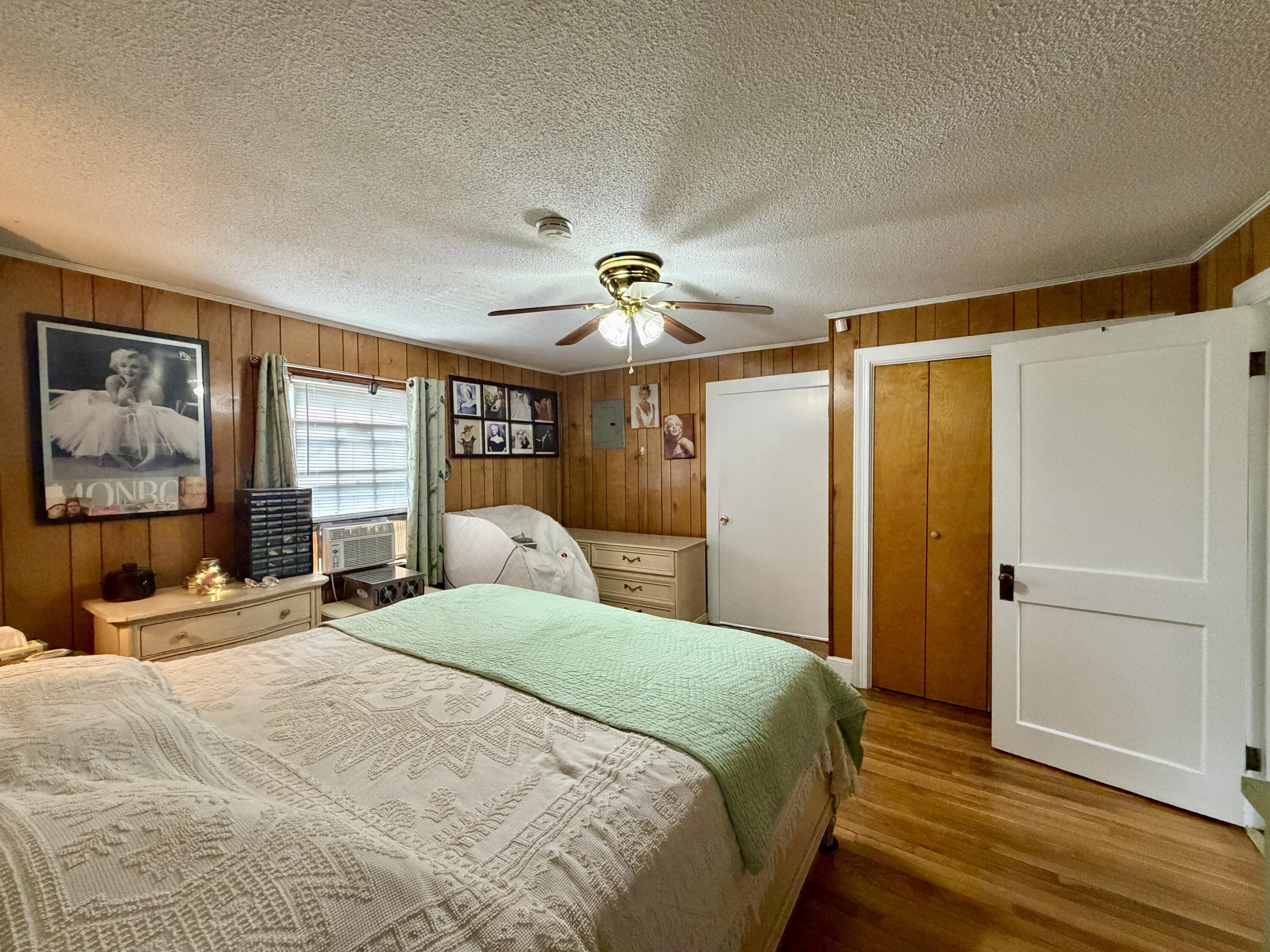 1491 Jones Ridge Road Axton, VA 24054 - Photo 8 of 17 a bedroom with a bed and a large window