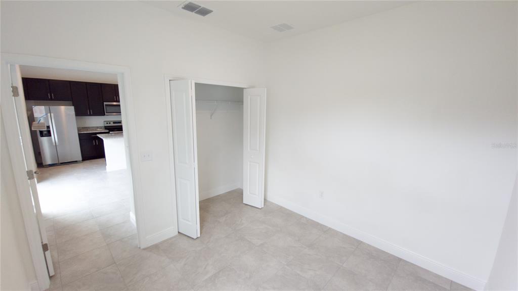 6325 Southwest 144th Lane Road Ocala, FL 34473 - Photo 29 of 31 a view of a kitchen with a refrigerator
